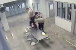 Maricopa County Jail guards beat a handcuffed inmate